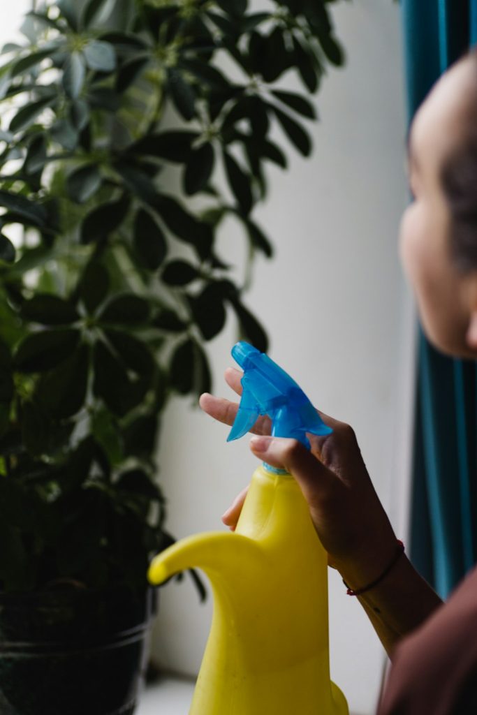 a-woman-is-holding-a-blue-and-yellow-banana-4nncnxjwkvi